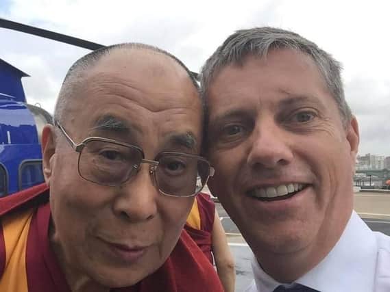 Undated picture of the Dalai Lama (right) with Eric Swaffer who died when the helicopter that he was piloting crashed just yards from Leiicester City Football Club Stadium on Saturday evening.