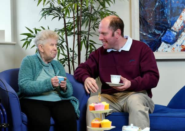 Henrietta Magill, from south Belfast, with her volunteer befriender Paul Taylor. Volunteer Now are urging people to help out for Befriending Week
