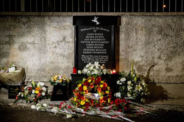 Flowers laid at the memorial site of the Greysteel massacre after a vigil to commemorate the 25th anniversary of eight people being murdered on 30 October 1993 by members of the UFF. Photo credit: Liam McBurney/PA Wire