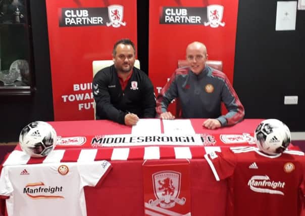 Martin Carter (left, Middlesbrough head of Academy recruitment) and Portadown FC Youth's Noel Cowan at Shamrock Park confirming the paperwork.