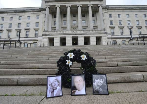Three white lilies representing those who have yet to be found, Joe Lynskey, Columba McVeigh and Robert Nairac.
Picture By: Arthur Allison/Pacemaker Press