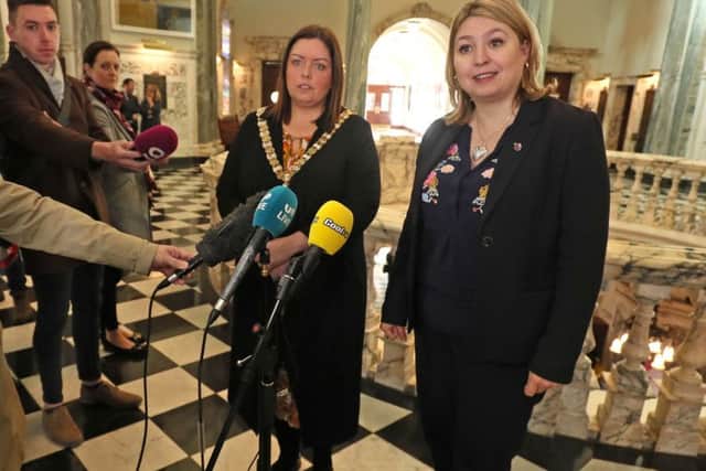 Karen Bradley (right) and Belfast Lord Mayor Deirdre Hargey talk to the media after the City Hall meeting