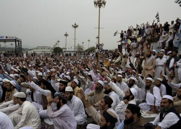 Supporters Pakistani religious party Jamiat Ulema-e-Islam rally near the Parliament to condemn a Supreme Court decision that acquitted Asia Bibi, in Islamabad, Pakistan