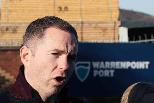 Sinn Fein's Chris Hazzard, MP for South Down, speaking to the media at the entrance to Warrenpoint Port, Newry.