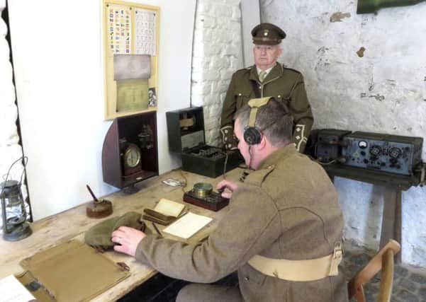 Lisbellaw & South Fermanagh WW1 Society's Tony Watson and Brian Johnston reenacting the receiving of the morse code message, as Enniskillen claims to have been first place in the UK to celebrate Armistice Day. Pic by PA Wire
