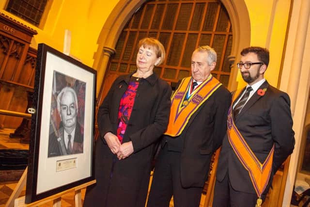 Viewing the portrait of the late Lord Laird are (from left) Lady Laird, William Smart, worshipful master LOL 1690; and Graham Barton, treasurer LOL 145. Pics by Graham Baalham-Curry