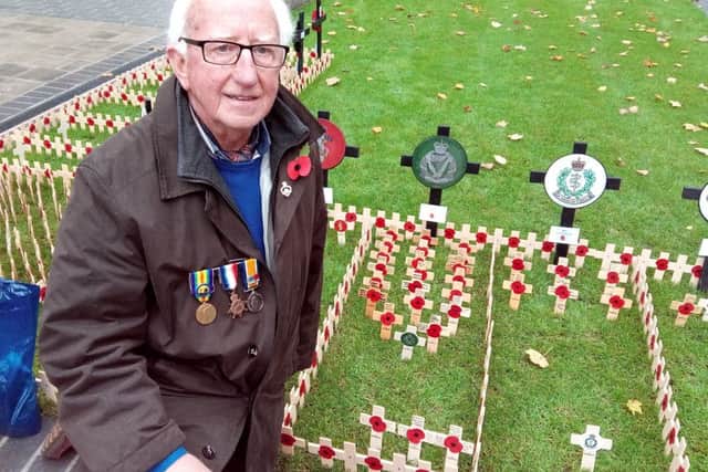 Harold Gordon from Saintfield placed two crosses at the Belfast City Hall in memory of his uncles Reuben and Jack Peake of the Royal Irish Rifles