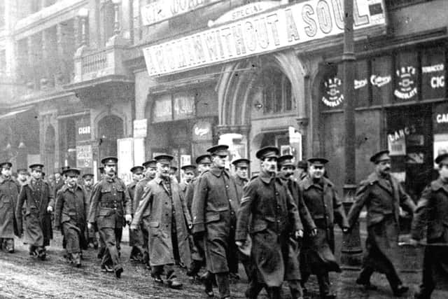 Undated handout photo issued by the University of Exeter of soldiers marching past a cinema.. PRESS ASSOCIATION