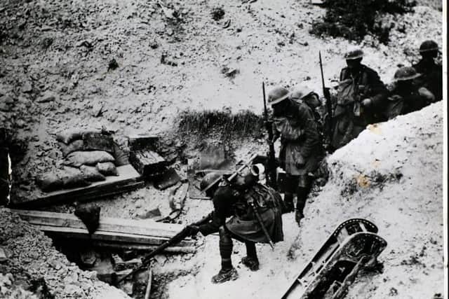 British troops firing into a German dugout on the Western Front. Picture courtesy of Ancestry.co.uk and Getty Images Archive