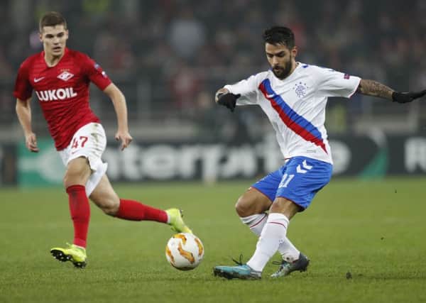 Spartak's Roman Zobni and Rangers' Daniel Candeias challenge for the ball