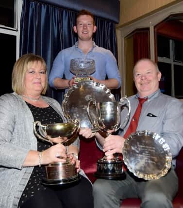 Amanda and Noel Priestley pictured with son Mark with their trophies for small Flock Winner, Best Pen of Ewe Lambs, Best stock ram and Champion Flock in the 2018 Flock Competition and NI Sire of the Year.