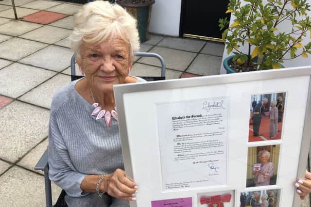 Pat Martin with a special memento of her big day at Buckingham Palace when she was awarded the MBE for services to road safety.