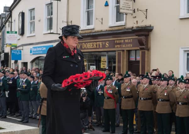 DUP leader Arlene Foster laying a poppy wreath at the Enniskillen Cenotaph on Remembrance Sunday.
