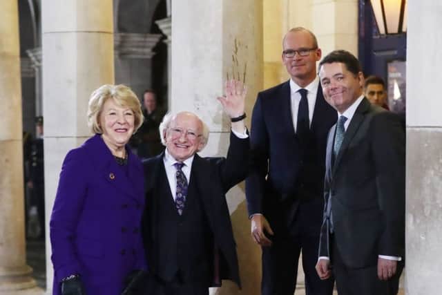 Michael D Higgins and his wife Sabina are greeted by Simon Coveney (second right) and Paschal Donohoe (right) as Mr Higgins arrives at Dublin Castle to be inaugurated as president for a second term