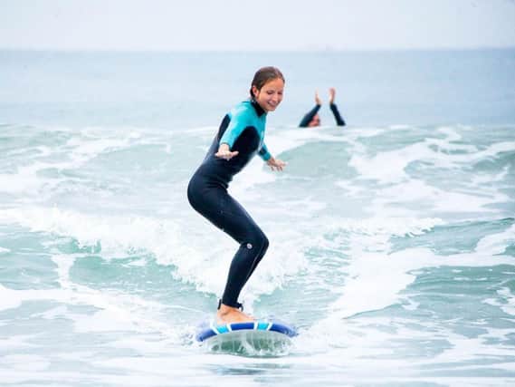 A woman surfing - generic