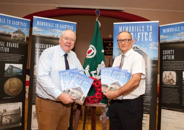 Mervyn Gibson, Grand Secretary of the Grand Orange of Ireland (left), with Nigel Henderson, History Hub Ulster, at the launch of the Memorials to Sacrifice exhibition and booklet