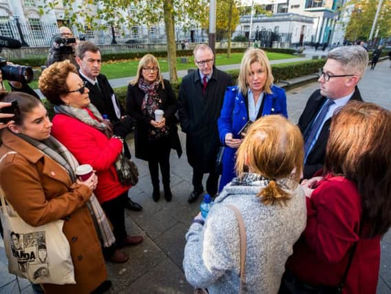 Sinn Fein politician Rose Conway-Walsh (centre) speaking with families of those killed during the Ballymurphy massacre, outside Laganside Courts in Belfast