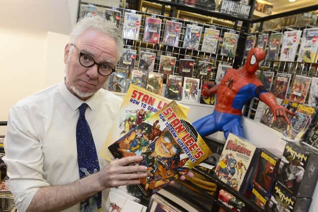 Mal Coney, manager of the Forbidden Planet International store in Belfast, pays tribute to American writer and former president of Marvel Comics Stan Lee, who died at the age of 95. Lee created The Fantastic Four for Marvel Comics in 1961 and went on to create titles including Spider-Man and The Incredible Hulk. Pic by Arthur Allison/Pacemaker Press