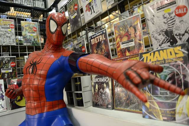 The Spider-Man figure in Belfast's Forbidden Planet store has been given a black armband as staff at the shop pay tribute to the superhero's creator Stan Lee. Picture by Arthur Allison/Pacemaker Press
