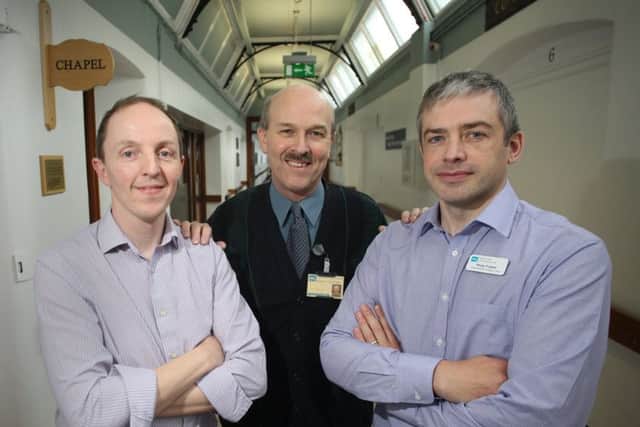 Dr Paul Hamilton, Rev Derek Johnston and Philip Frizzell pictured at the Royal Victoria Hospital.