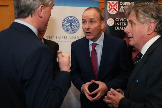 Fianna Fail leader Micheal Martin (centre) during a conference on Brexit at Queen's University Belfast.