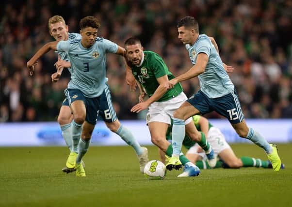 Northern Ireland's Jordan Jones on the ball but under pressure from Republic of Ireland's Conor Hourihane at the Aviva Stadium in Dublin.
 Pic by Pacemaker.