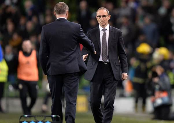 Repubic of Ireland manager Martin O'Neill and Northern Ireland boss Michael O'Neill at the final whistle in Dublin. Pic by Pacemaker.