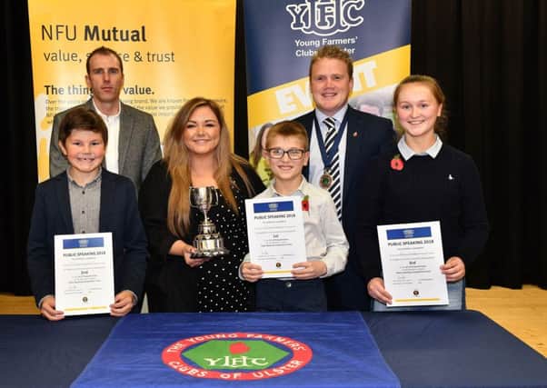 James Speers, YFCU president, Robert Caldwell from sponsors NFU Mutual, and Hannah Spratt, broadcast journalist at Q Radio and Donaghadee YFC member pictured with the winners of the 12-14 category at the YFCU public speaking finals, (left to right) Philip Crawford (Seskinore YFC), James Gregg (Glarryford YFC) and Amy Gregg (Glarryford YFC)