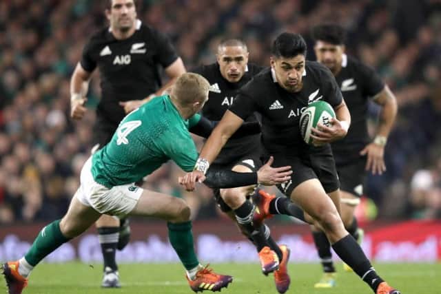 Ireland's Keith Earls makes a tackle as New Zealand attack
