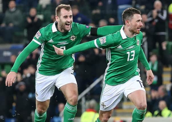 Niall McGinn (left) with Corry Evans following Northern Ireland's equaliser against Austria. Pic by INPHO.