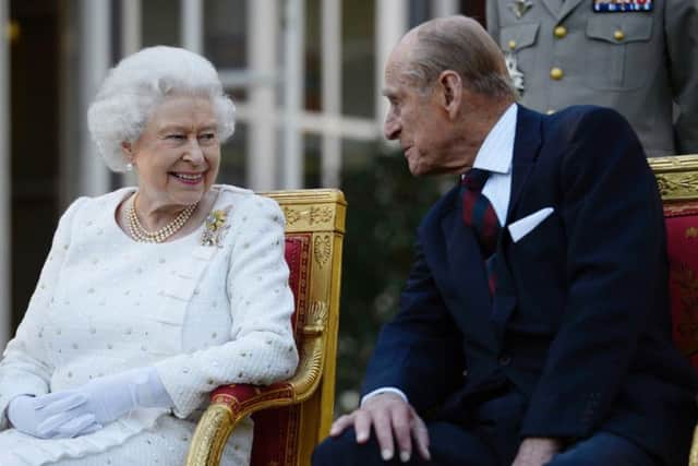 File photo dated 05/06/14 of Queen Elizabeth II and the Duke of Edinburgh. The royal couple married on November 20 1947 at Westminster Abbey and are celebrating a rare achievement  their 71st wedding anniversary.