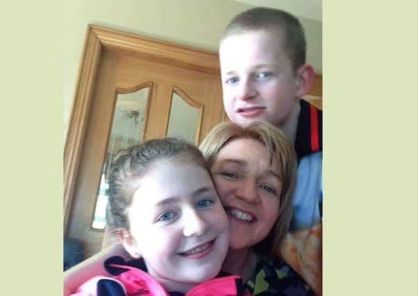 Bernie Devlin with her son Liam (13) and daugher Aine (11)