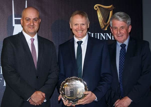 Simon Lewis, Chairman of the Rugby Writers of Ireland and Roddy Guiney, Chairman of Federation of Irish Sport present Ireland Head Coach Joe Schmidt with the Dave Guiney Team of the Year award