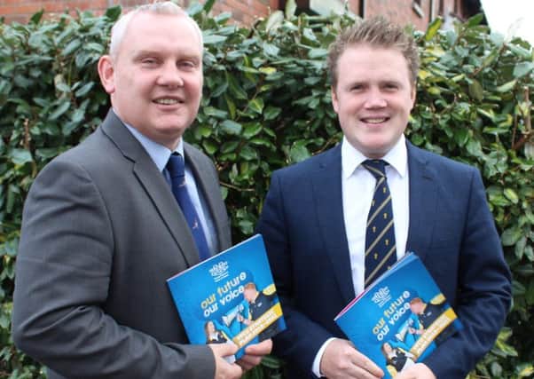Attending the launch of the YFCUs three-year strategy document are McCallister, manager Land Mobility Programme, and James Speers, YFCU president