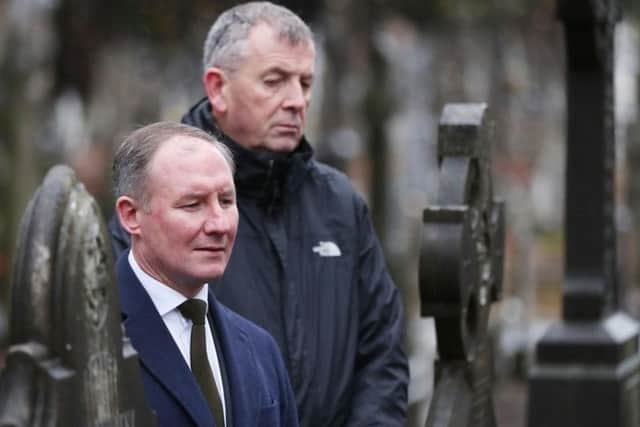 Dublin GAA manager Jim Gavin (left) at the unveiling of a monument to 14-year-old John William Scott, who was shot and killed on Bloody Sunday at Croke Park in 1920 when British forces opened fire during a GAA match, in Dublin's Glasnevin cemetery