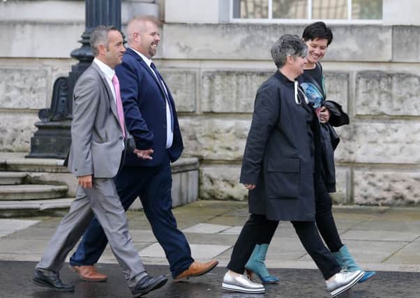 Partners Sharon Sickles and Grainne Close along with Henry and Chris Flanagan-Kane leave the High Court in Belfast after a previous hearing