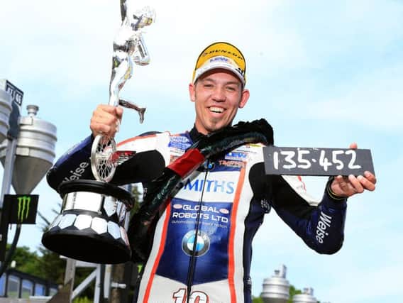 Peter Hickman set a new sizzling outright lap record of 135.452mph on his way to victory in the Senior race at the Isle of Man TT on the Smiths BMW.
