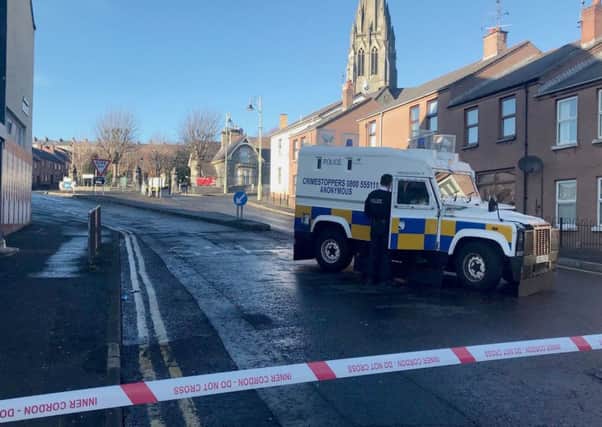A police cordon near to Creggan Street, Londonderry, after the body of a young man was discovered in an alleyway in the early hours of Sunday morning. Photo: Aoife Moore/PA Wire