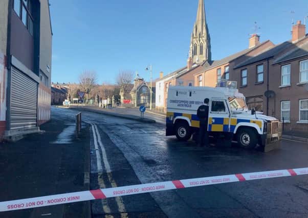 A police cordon near to Creggan Street, Londonderry, after the body of a young man was discovered in an alleyway in the early hours of this morning. Photo credit: Aoife Moore/PA Wire
