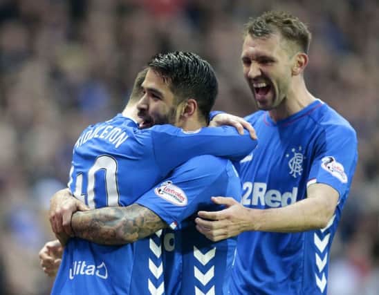 Rangers' Daniel Candeias (centre) celebrates scoring his side's first goal of the game with team-mates Glenn Middleton (left) and Gareth McAuley. Photo credit: Graham Stuart/PA Wire.