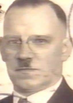 Alois Hitler with half-brother's signature Â‘ToothbrushÂ’ Moustache. Identity document, early 1940s