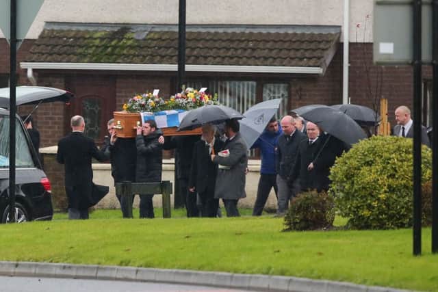Mourners gathered for the funeral of Robin 'Rab' McMaster, who was found dead at his home at Devenagh Court, Ballymena on November 22.
 
His coffin was draped in the colours of his beloved football team, Ballymena United. Picture by PressEye