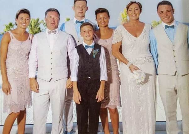 Brian Braiden (second left) and his wife, Carol (second from right) pictured with their four children and grandson at their wedding three years ago in Cyprus