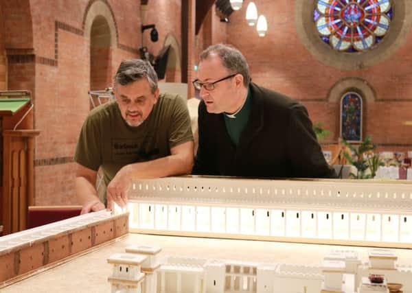Canon Simon Doogan (right) with Paul Hames from The Churchs Ministry Among Jewish People watching the temple model take shape.