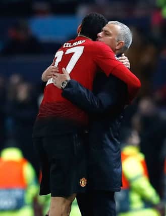 Manchester Uniteds Marouane Fellaini and boss Jose Mourinho