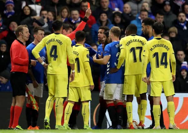 Rangers' Daniel Candeias gets a red card for a second bookable offence for a challenge Villarreal's Pablo Fornals.