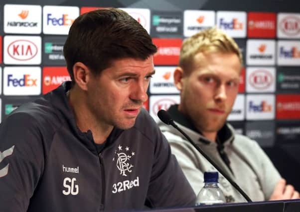 Rangers manager Steven Gerrard (left) and Scott Arfield during the press conference at Ibrox