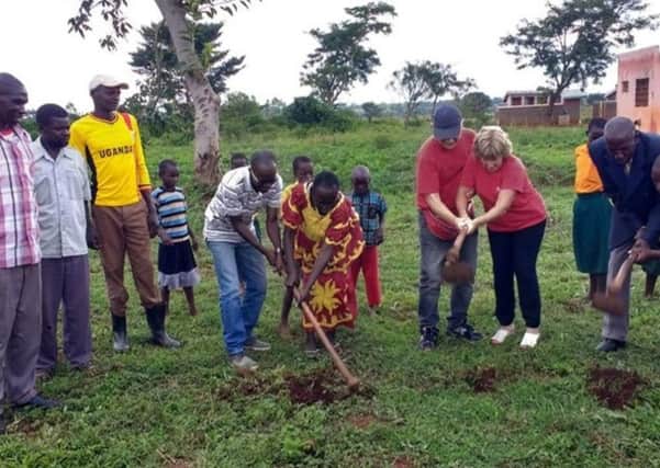 Dr Dickie Barr and his wife Janice help begin work on a new Nursery School in Uganda as part of Charlene's Project