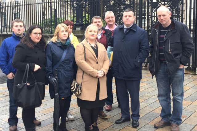 Loughinisland families with lawyers and supporters outside Belfast High Court this morning.