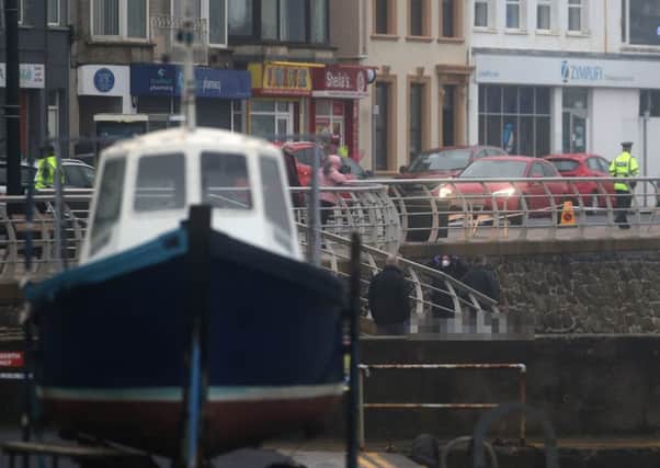 Police hold a scene on Portstewart Promenade this afternoon after a body was found close to the harbour. A large area of the town was sealed off on Sunday. Pic Steven McAuley/McAuley Multimedia
